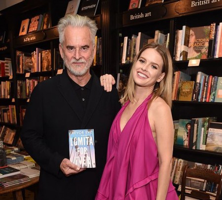 Trevor Eve with his daughter, Alice Eve showing Trevor's book
