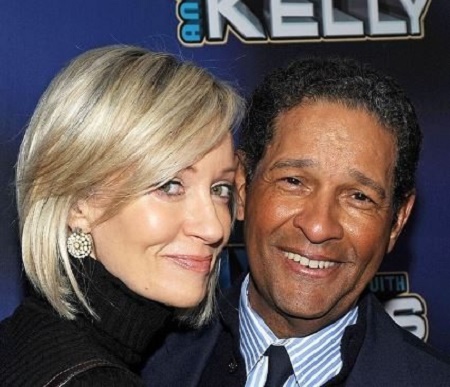 Bryant is posing with his wife, Hilary in an event