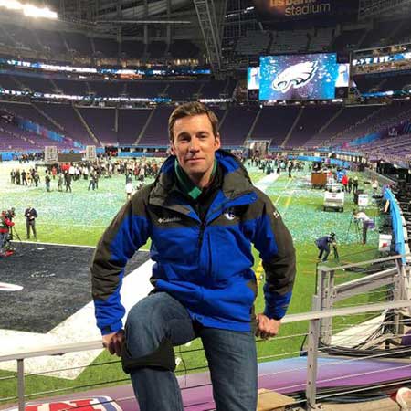 Brian posing at stadium.