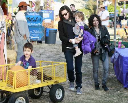Levi Adler with his parents, Sara Gilbert and Allison Adler carrying Sawyer