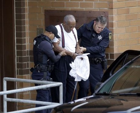 Bill was escorting by two police office towards general population