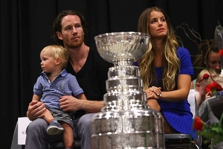 Alexandra Stewart along side Duncan Keith and his son Colton Keith