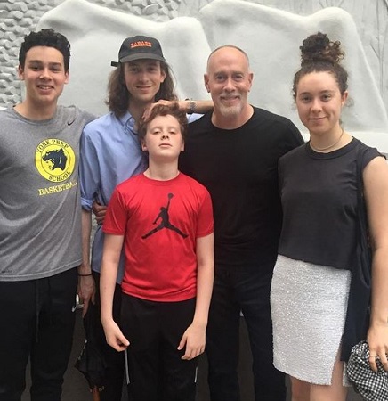 Marc hanging out with his kids.