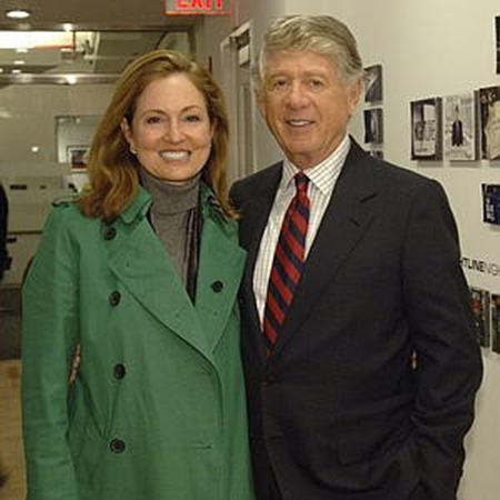 Andrea and her father are smiling for a picture