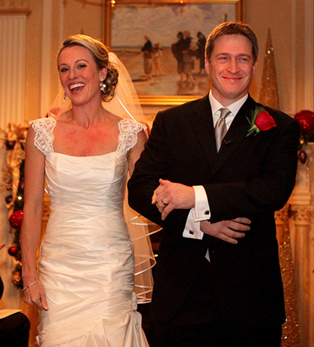 Leigh is walking, alongside Sam on their wedding