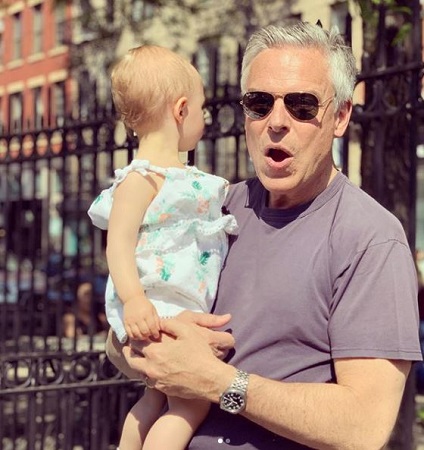 Jon Huntsman Jr. holding his grandchildren