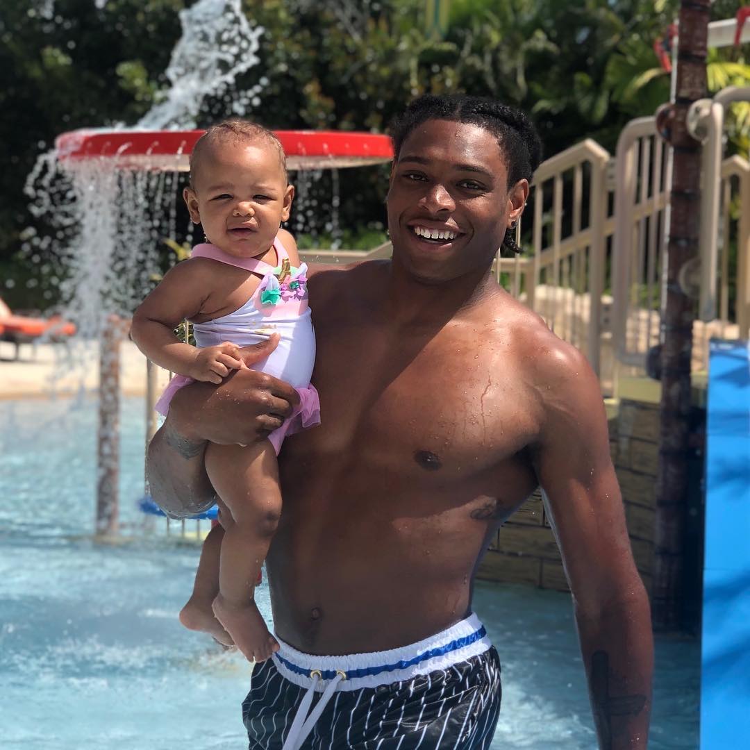 Jalen carrying his daughter