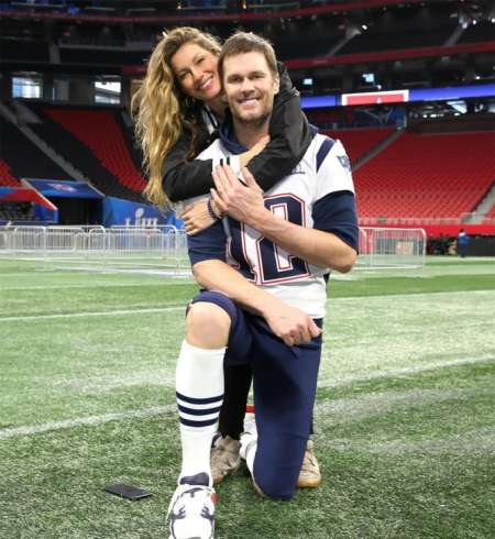 Gisele Bundchen hugging her husband, Tom Brady