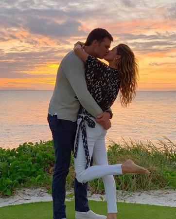 Tom Brady and his wife, Gisele sharing love.