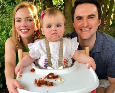 Kayla and Jeffrey with their daughter on her first birthday
