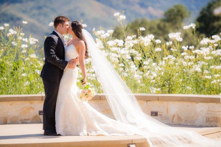 Kaitlyn Plum and Matthew J. Lawrence kissing at their wedding 