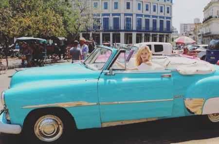Abby Hornacek in the vintage car
