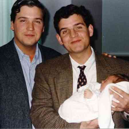 Susan Andrews' husband, Tucker Carlson carrying his first daughter, Lillie Carlson