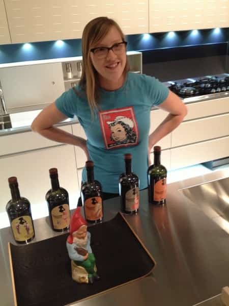 Bianca Beets displaying her wine bottles