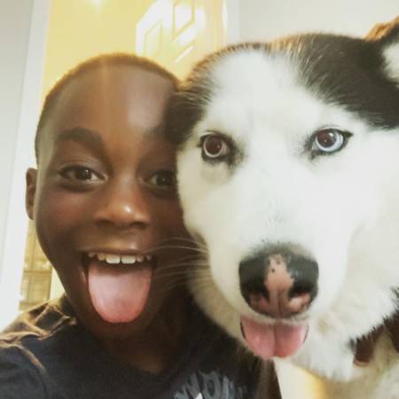 Braylon Howard spends quality time with his pet dog, Blue