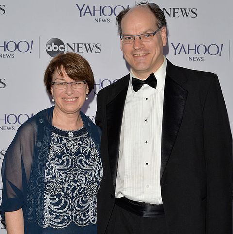 Amy and her spouse, John in an award function