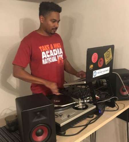 Omar Abdul Ali playing disc jockey