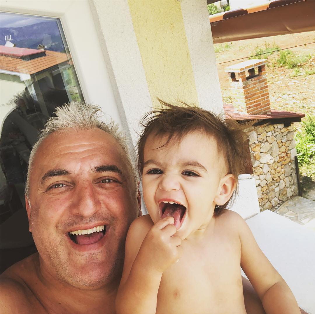 Sasa taking selfie with his probable child