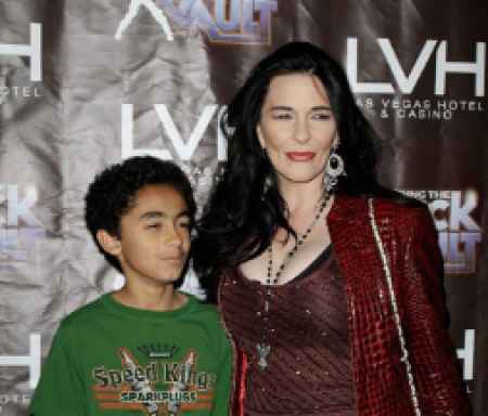 Tomi and son James posing for a picture at an event