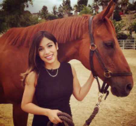 Natasha with horse at her horse shed