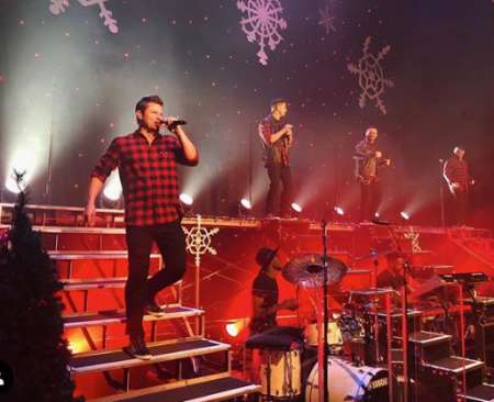 Nick on a live performance. Know more about Nick net worth, age, brother, Instagram, songs, and other details