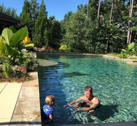 Father Jones and brother Cooper in the pool of his Multi-million masion. Know more about his net worth, salary, income, wages, total wealth and many other details