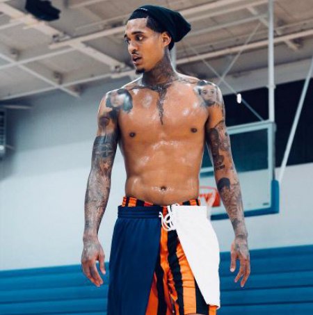 Jordan Clarkson displaying his Tattoos while working out
