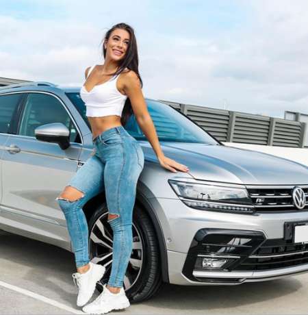 Danielle in her new Volkswagen. Know her net worth, salary, earnings, wealth