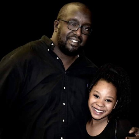 Alan Kasujja with his daughter, Keyena