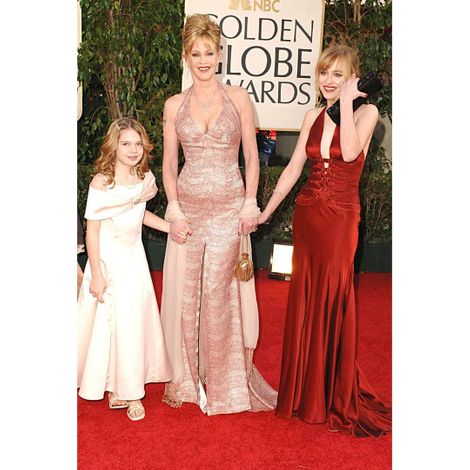 Dakota Johnson with her mother and a sister