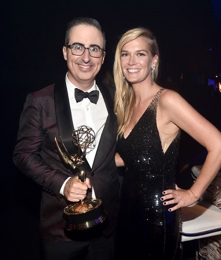 Kate Norley's husband holding a award