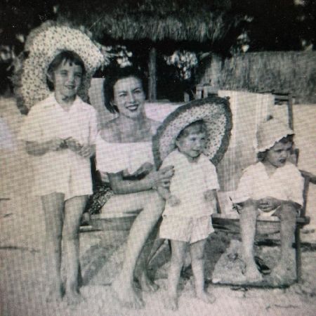 Childhood photo of Lauren Cook with her grandma and siblings