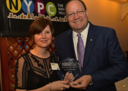 Abigail Pesta receiving an award for her outstanding work