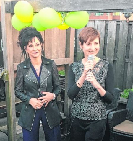 Photo of Abigail Pesta while interviewing the former judge of America's Got Talent, Vallonia