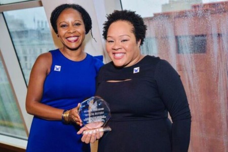 Christina Greer giving an honorary award her friend, Yamiche Alcindor at the NYU McSilver Award ceremony