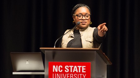 Charlene Carruthers is giving lecture to the young youth to think and do the extraordinary