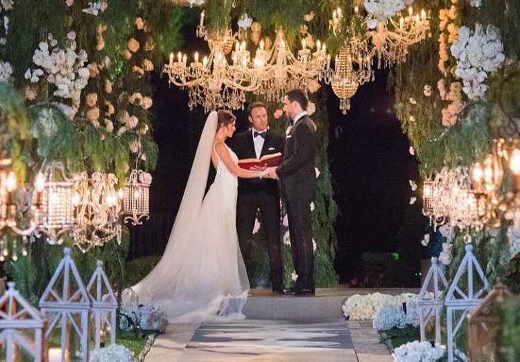 Jade Roper (left) and Tanner Tolbert (right) exchanging wedding vows