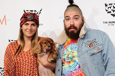 Katie along with her former husband and dog at a public event. 