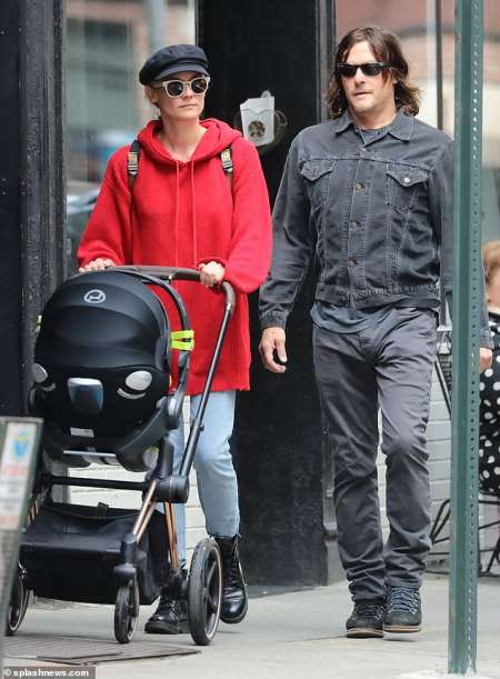 Diane Kruger and Norman Reedus taking their newly born child for a walk