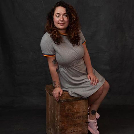 Liza looks beautiful in grey dress.