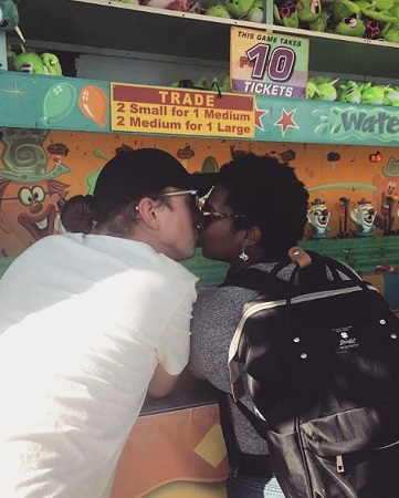 Ashley kissing her boyfriend, Kelly