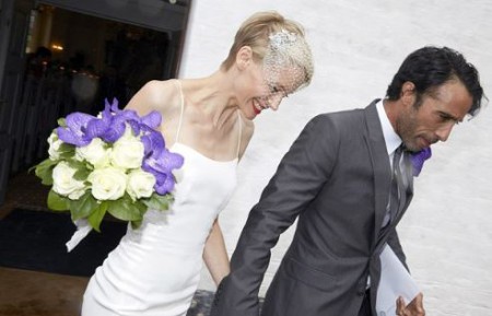 Betina and her spouse Carlos walking out of the church from their wedding