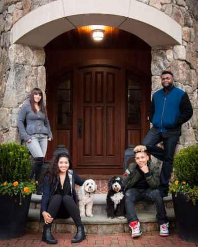 David Ortiz with his family in front of his house