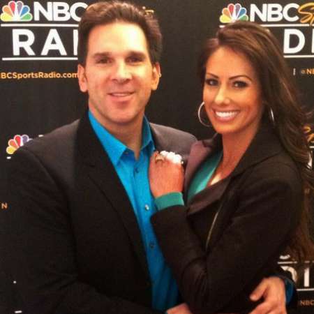 Holly Sonders and her husband, Erik Kuselias 