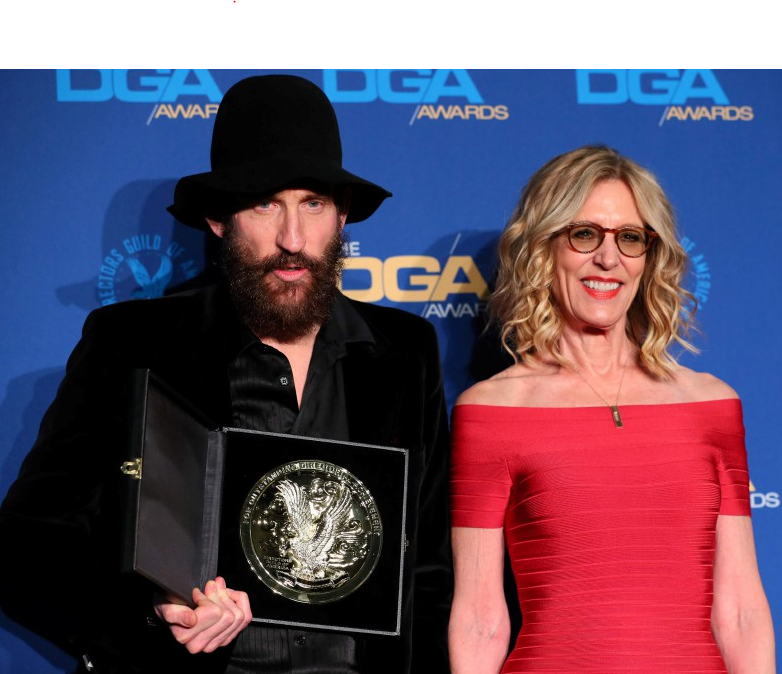 Johan Rencks receiving awards at DGA Awards alongside, Christine Lahti