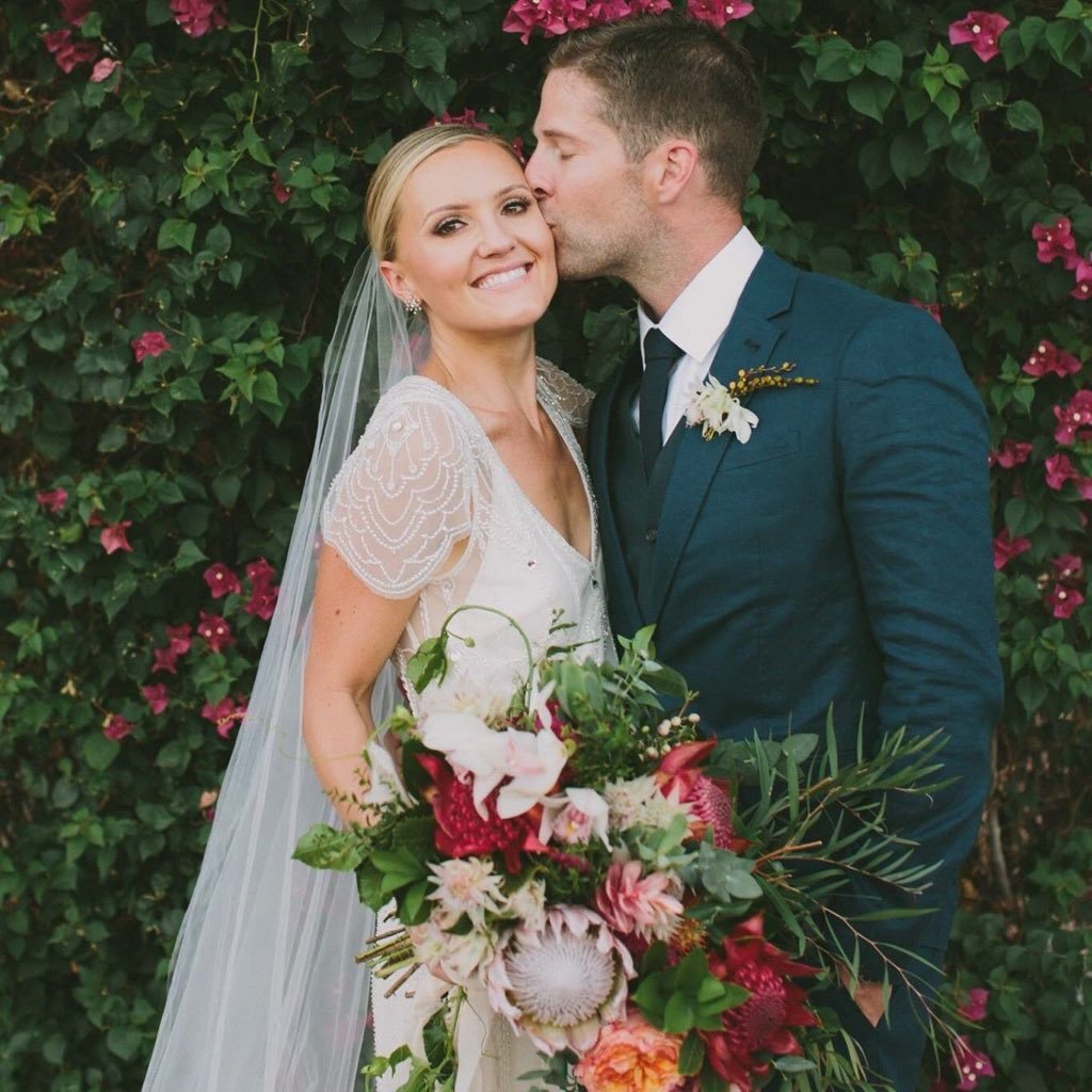 Kevin Simshauser with his beautiful wife, Taylor Cole, on their wedding day on October 2, 2015.