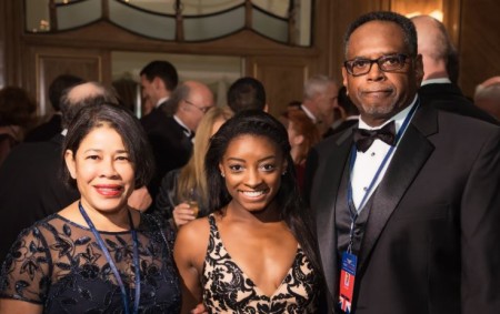 Simone with her parents.