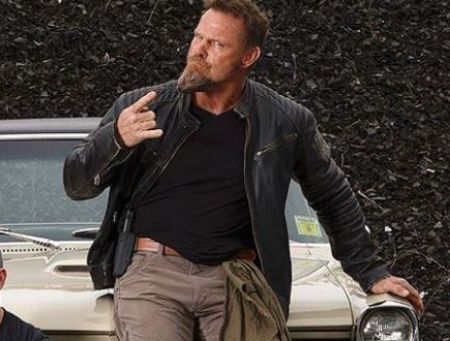 Pat McNamara posing with his 1965 Pontiac GTO.