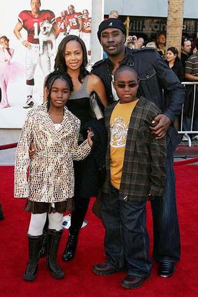 Grant with his father Morris, mother Pam, and younger sister Paige.