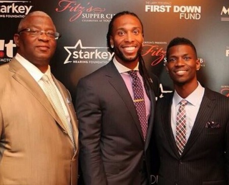 : Larry Fitzgerald Jr with his father and brother Marcus Fitzgerald.